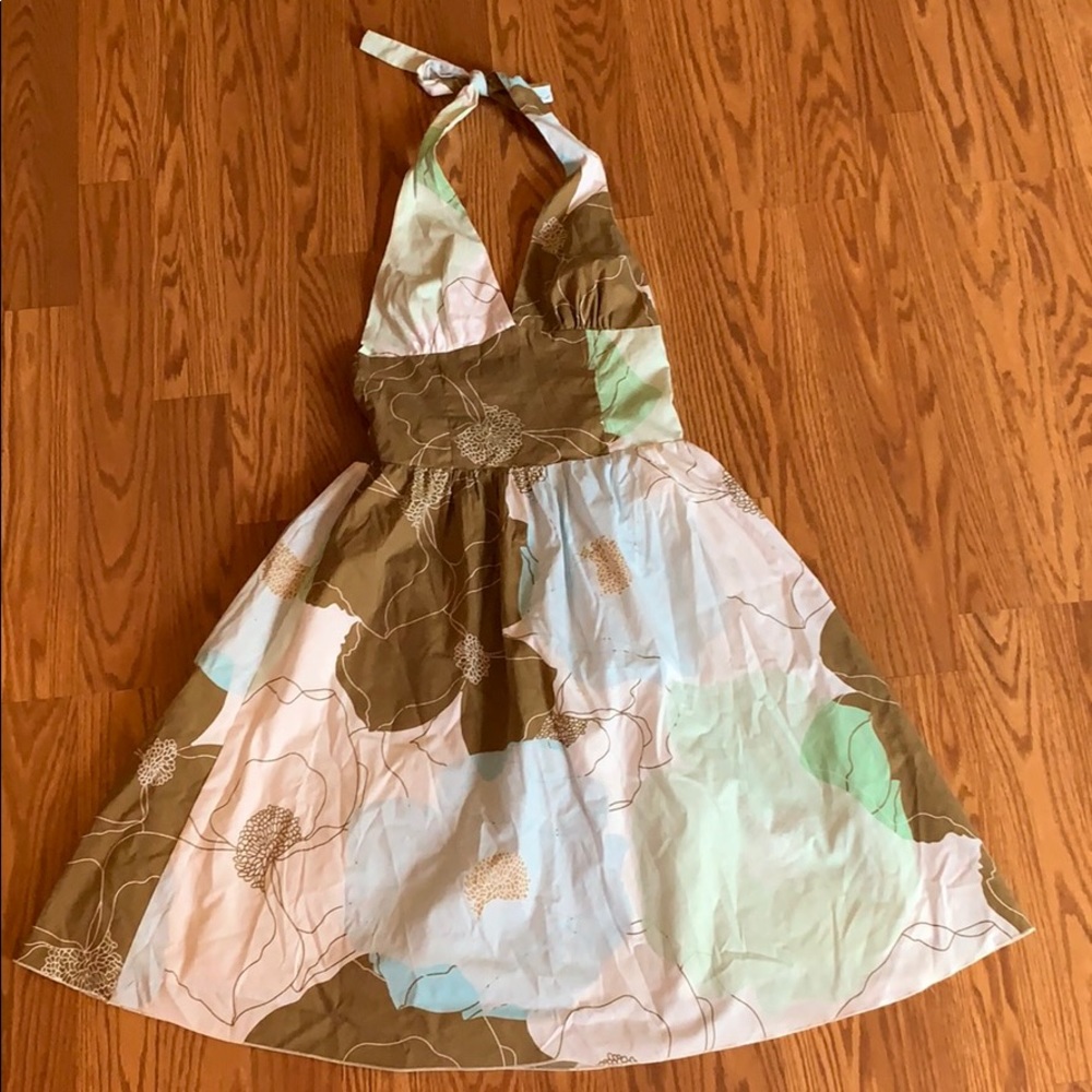 Floral dress. Ties around the neck. Open back